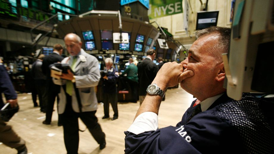 Stock trader reacting on the New York Stock Exchange trading floor during the 2008 global financial crisis.